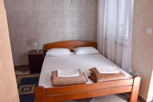 Postel nebo postele na pokoji v ubytování Apartmani Masa