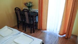 Postel nebo postele na pokoji v ubytování Willa Arkadia