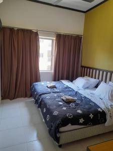 Un pat sau paturi într-o cameră la fcaa 8pax Gold Coast Morib Resort - Banting Sepang KLIA Tanjung Sepat +24 fotografii