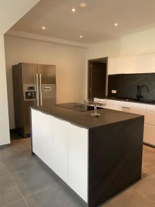 Kuchyň nebo kuchyňský kout v ubytování Résidence LMG