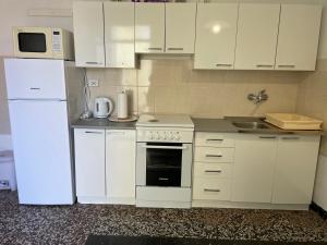 Kuchyňa alebo kuchynka v ubytovaní Apartman Zablace