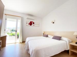 Postel nebo postele na pokoji v ubytování Habitaciones Camping Ferrer