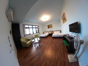 Postel nebo postele na pokoji v ubytování Jiufen Yunhai Yazhu Homestay