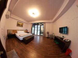 Postel nebo postele na pokoji v ubytování Jiufen Yunhai Yazhu Homestay