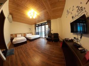 Postel nebo postele na pokoji v ubytování Jiufen Yunhai Yazhu Homestay