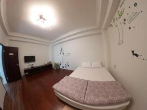 Postel nebo postele na pokoji v ubytování Jiufen Yunhai Yazhu Homestay