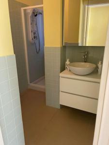 a bathroom with a sink and a shower at Ocean View Villa with Fast WI-FI and Elevator to Town in Levanto +8 photos