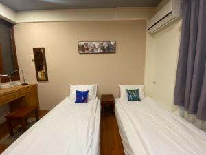 En eller flere senge i et værelse på 阿鑫民宿
