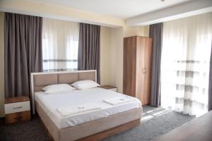 Hotel Roma客房内的一张或多张床位