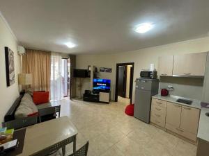 a large living room with a kitchen and a living room at private apartments in Apolon in Ravda