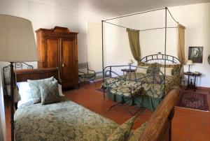 Postel nebo postele na pokoji v ubytování Agriturismo La Casa in Collina