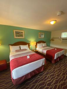 Postel nebo postele na pokoji v ubytování Cozy Corner Motel