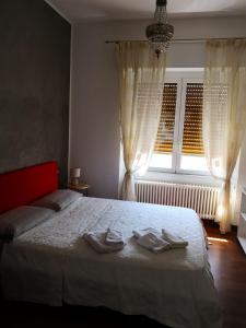 Кровать или кровати в номере Il tango del gatto