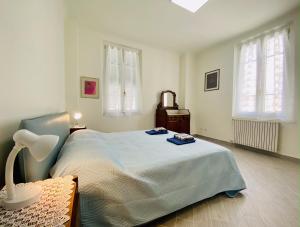 Posteľ alebo postele v izbe v ubytovaní Hostdomus - Trilocale Da Dino