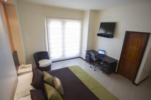 TV a/nebo společenská místnost v ubytování Hotel La Laguna Galapagos