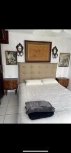 a bedroom with a bed with a pillow on it at Bahia Smir in Restinga Smir