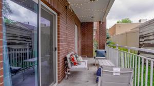 a balcony with a bench and a glass door at Downtown, KING Bed, Fast WiFi! in Salt Lake City