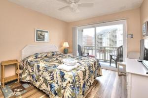 Postel nebo postele na pokoji v ubytování Oak Island Beach Villa 801 + 41 fotografií