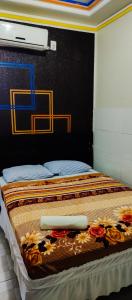 Ένα ή περισσότερα κρεβάτια σε δωμάτιο στο Pousada e restaurante portofolhense