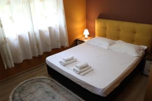 Postel nebo postele na pokoji v ubytování Hotel Ceka