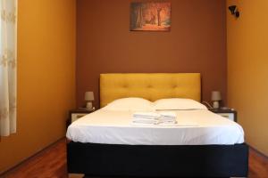 Postel nebo postele na pokoji v ubytování Hotel Ceka