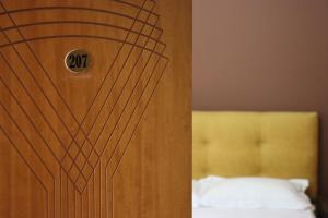 Postel nebo postele na pokoji v ubytování Hotel Ceka