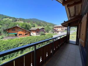 a balcony with a view of a mountain at Petit Lutin - Chalet sur les pistes in La Clusaz