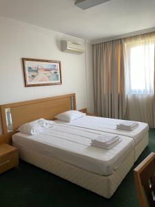 Łóżko lub łóżka w pokoju w obiekcie private apartments in Emerald