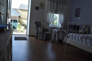 Posteľ alebo postele v izbe v ubytovaní La Little School Chambres d'Hôtes à Arçay