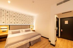 Cama ou camas em um quarto em Hotel Antonio II