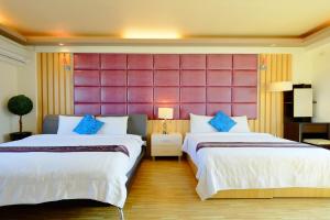 Giường trong phòng chung tại Yudo B&B Yilan