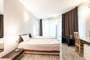 Ένα ή περισσότερα κρεβάτια σε δωμάτιο στο Hotel Juli