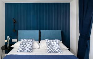 Ένα ή περισσότερα κρεβάτια σε δωμάτιο στο Capri Blue Luxury Villa Le Tre Monelle