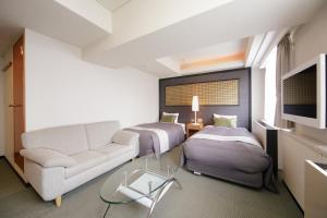 Postel nebo postele na pokoji v ubytování Grand Park Hotel EX Fukushimaebisu + 35 fotografií