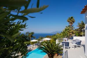 a view of the pool at a resort at Capri Blue Luxury Villa Le Tre Monelle in Anacapri