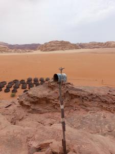 a group of chairs sitting in the desert at bedouin future camp in Wadi Rum