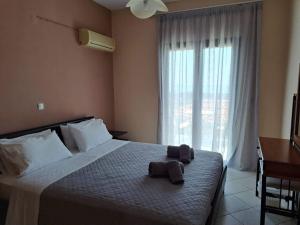Ένα ή περισσότερα κρεβάτια σε δωμάτιο στο Oneira Villas Mousata
