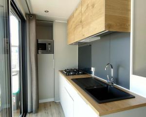 A kitchen or kitchenette at Garda Di Vino Agricamping & Wine Shop Lazise