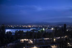 a view of a city at night at Bestshome Apartments in Bishkek