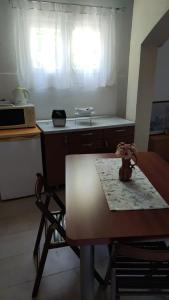 Kuchyňa alebo kuchynka v ubytovaní Apartment Dalma