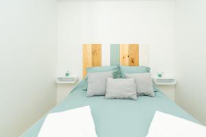 Postel nebo postele na pokoji v ubytování Apartamentos Manuel Roio