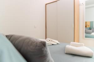 Postel nebo postele na pokoji v ubytování Apartamentos Manuel Roio + 18 fotografií