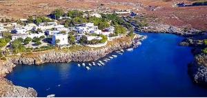 an aerial view of a house on an island in the water at Dimora Cinzia in Uggiano la Chiesa