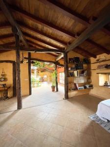 a large room with a wooden ceiling and a table at Musikarte Etxea in Estavillo