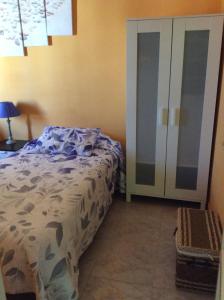 Łóżko lub łóżka w pokoju w obiekcie Casa Garome 14 PARKING GRATIS