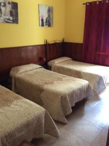 Posteľ alebo postele v izbe v ubytovaní Casa Garome 14 PARKING GRATIS