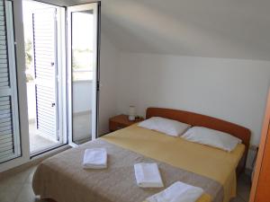 Postel nebo postele na pokoji v ubytování Villa Hana