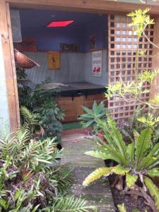 a patio with a pool table in a garden at Butlers Guesthouse in Birregurra