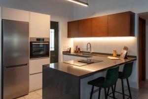 A kitchen or kitchenette at THE AA VILLA: Your Interactive Home Experience!