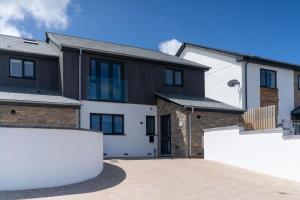 a house with a driveway in front of it at Tides in Carbis Bay